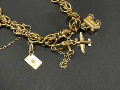 Gold bracelet with seven pendants.
Gold 750°/00.
L:...