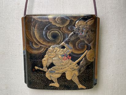 Lacquered wood inro with four squares decorated...