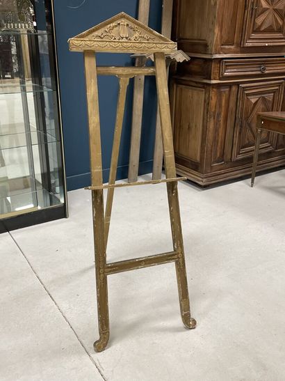 Wood and gilded stucco easel with a pediment...