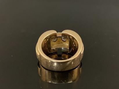 Gold tank ring set with two diamonds.
Weight:...