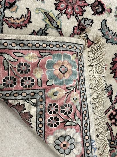 Silk carpet decorated with pink flowers on...