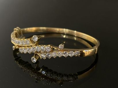 Gold bracelet set with lines of scrolling...