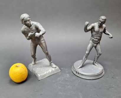 LUTTE: two alloy statuettes.
H: 24 and 22...