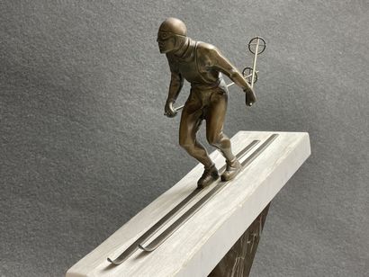 The skier. 
Sculpture in patinated bronze...