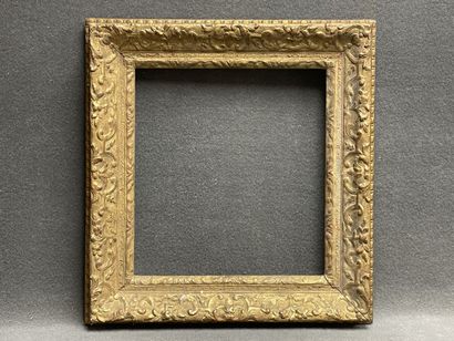 Wood and gilded stucco frame. 
Regency style
Interior...