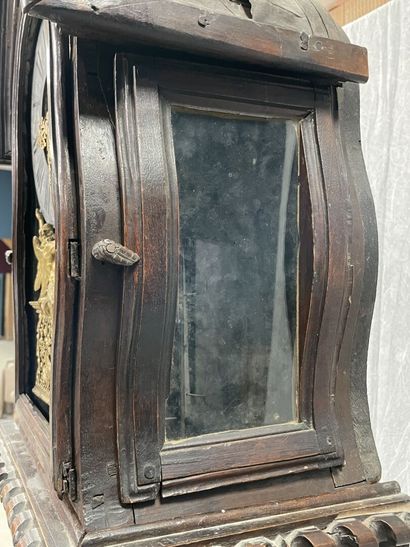 Carved oak floor clock, pewter dial supported...