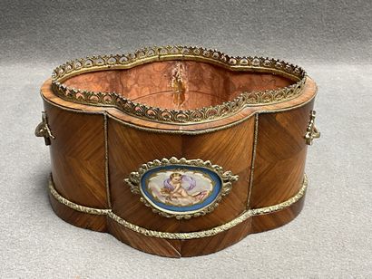 Wood veneer planter with bronze ornamentation....