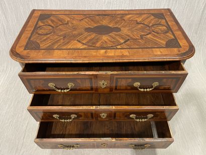 Rosewood-fringed chest of drawers, opening...