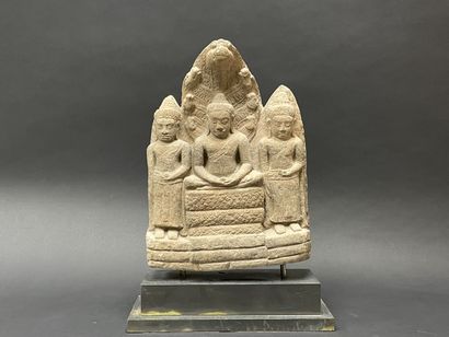 Buddhist triad depicting Mucalinda Buddha...