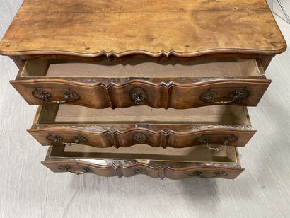 Molded walnut chest of drawers, crossbow...