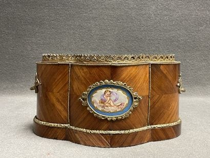 Wood veneer planter with bronze ornamentation....