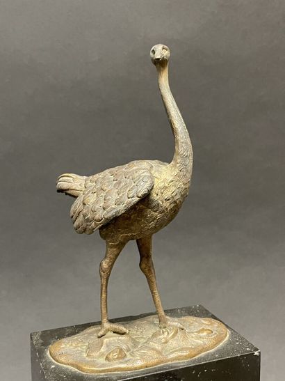 Ostrich clock.
Black marble base surmounted...