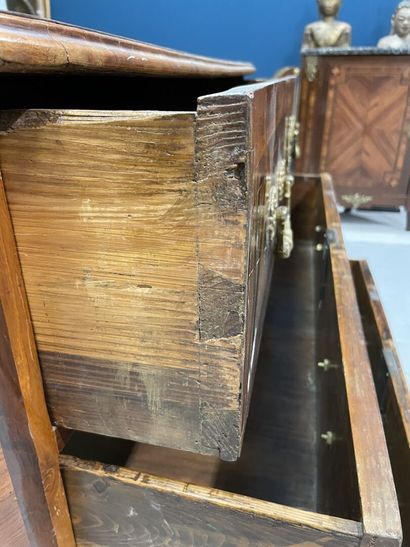 Rosewood-fringed chest of drawers, opening...