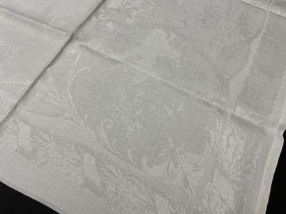 Set of nine large damask linen napkins decorated...