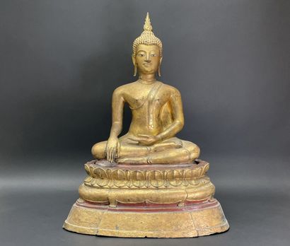 Buddha seated in virasana on a plinth adorned...