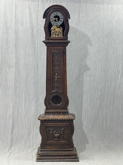 Carved oak floor clock, pewter dial supported...