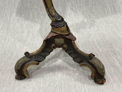 Carved wood pedestal table with patina, featuring...