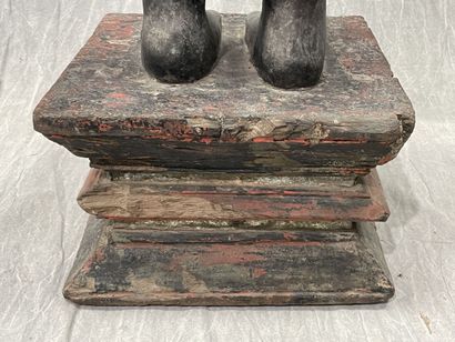 Ancient standing Buddha resting on a plinth,...