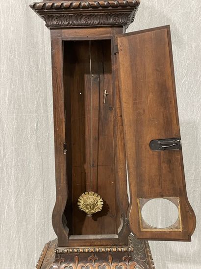 Carved oak floor clock, pewter dial supported...