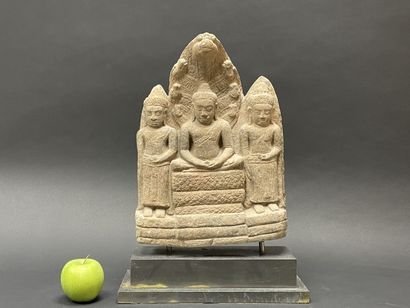 Buddhist triad depicting Mucalinda Buddha...