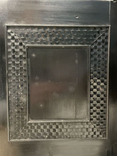 Cabinet in blackened wood opening to 9 drawers...
