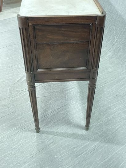 Mahogany console with two doors, white marble...