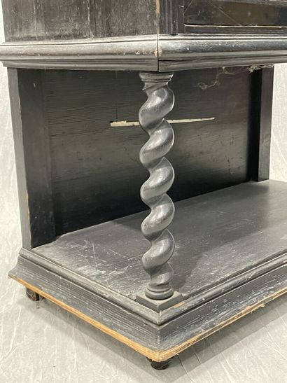Cabinet in blackened wood opening to 9 drawers...