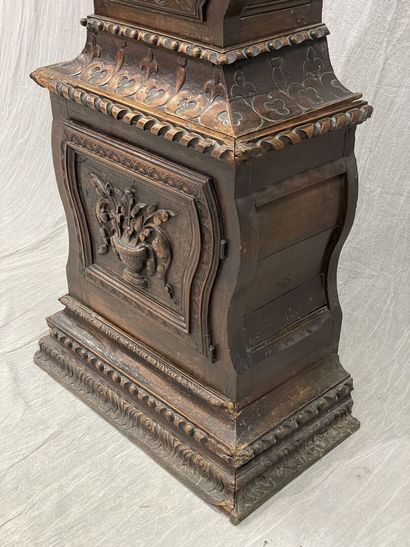 Carved oak floor clock, pewter dial supported...
