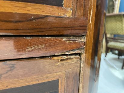 Rosewood-fringed chest of drawers, opening...