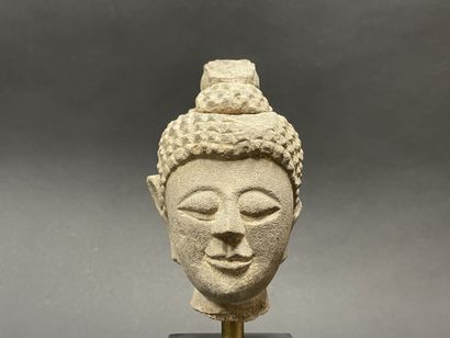 Old smiling Buddha head. Stoneware sculpture.
Siam...