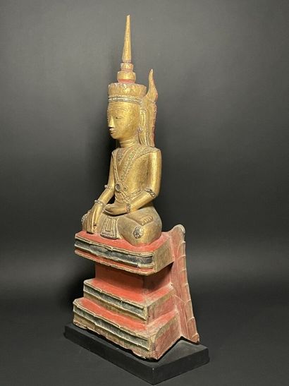 Buddha adorned in the royal effigy, wearing...