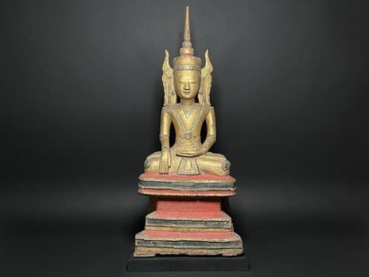 Buddha adorned in the royal effigy, wearing...