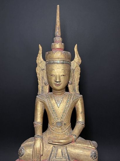 Buddha adorned in the royal effigy, wearing...