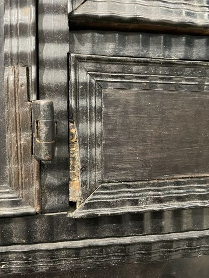 Cabinet in blackened wood opening to 9 drawers...