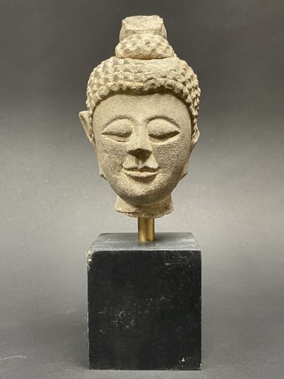 Old smiling Buddha head. Stoneware sculpture.
Siam...