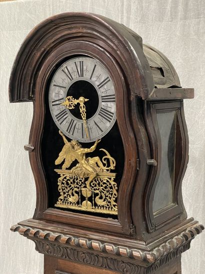 Carved oak floor clock, pewter dial supported...