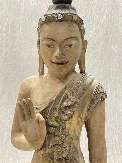 Standing Buddha.
Smiling youthful face, right...