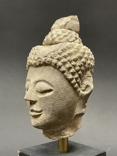 Old smiling Buddha head. Stoneware sculpture.
Siam...