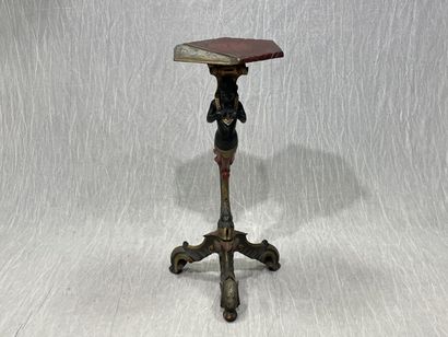 Carved wood pedestal table with patina, featuring...