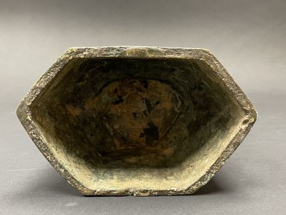 Ancient Buddha seated in majesty on a lotus-decorated...
