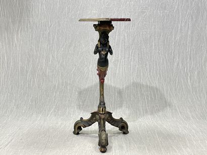 Carved wood pedestal table with patina, featuring...
