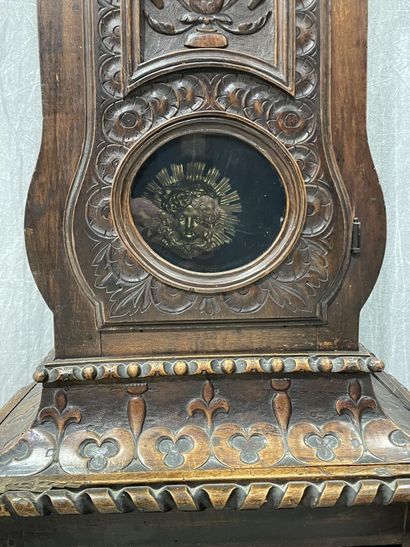 Carved oak floor clock, pewter dial supported...