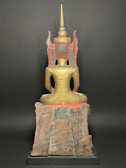 Buddha adorned in the royal effigy, wearing...