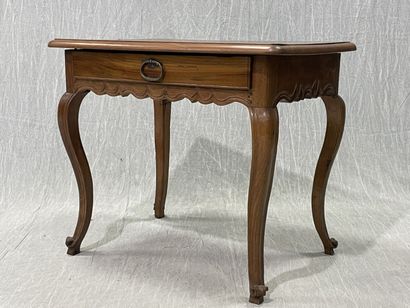 Walnut coffee table, opening to a drawer...
