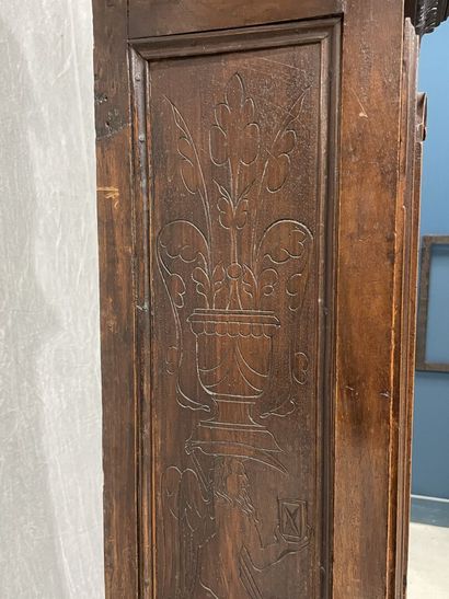 Carved oak floor clock, pewter dial supported...