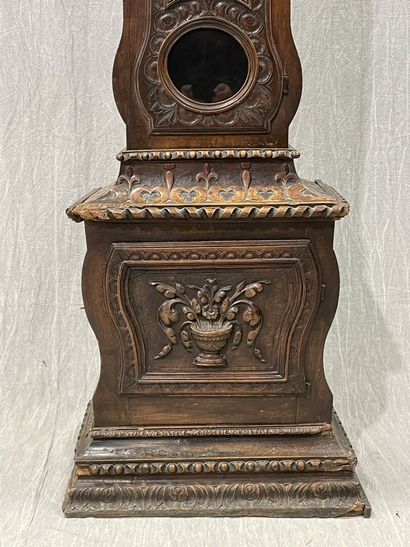 Carved oak floor clock, pewter dial supported...