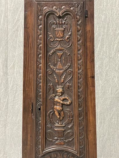 Carved oak floor clock, pewter dial supported...