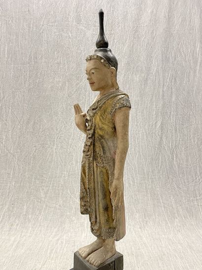Standing Buddha.
Smiling youthful face, right...