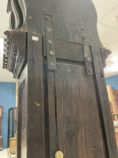 Carved oak floor clock, pewter dial supported...