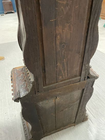 Carved oak floor clock, pewter dial supported...